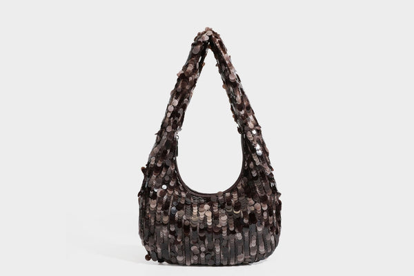 Slouchy crescent hobo shoulder bag covered in overlapping reflective sequin discs with a single integrated strap and top-zip
