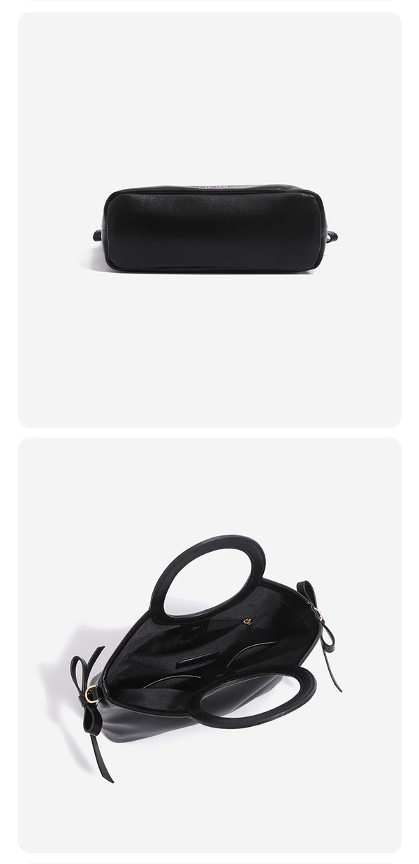 Strukturierte Henkeltasche in Lederoptik mit ovalem Tragegriff, seitlichen Bindebändern und goldfarbenen Metalldetails, Detailansicht 8