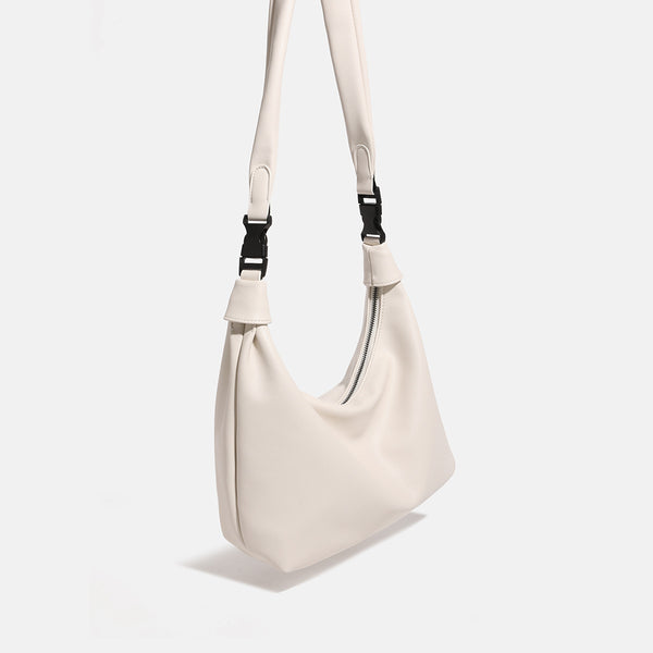 Slouchy leather-look hobo bag with knotted loop handle and top zipper closure, detail view 2