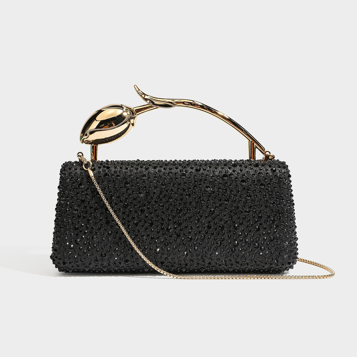 rectangular hard-case rhinestone evening clutch with sculptural gold-tone branch-and-bud top handle and detachable chain