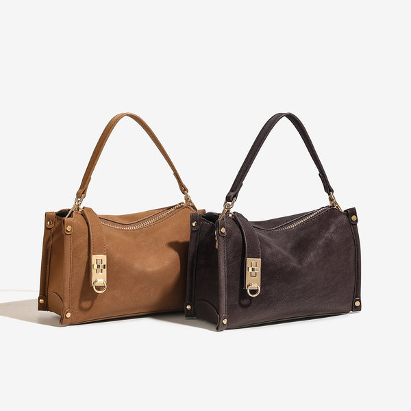 Small structured square handbag in deep dark brown matte pebbled finish with gold-tone turn-lock clasp, top zipper, corner