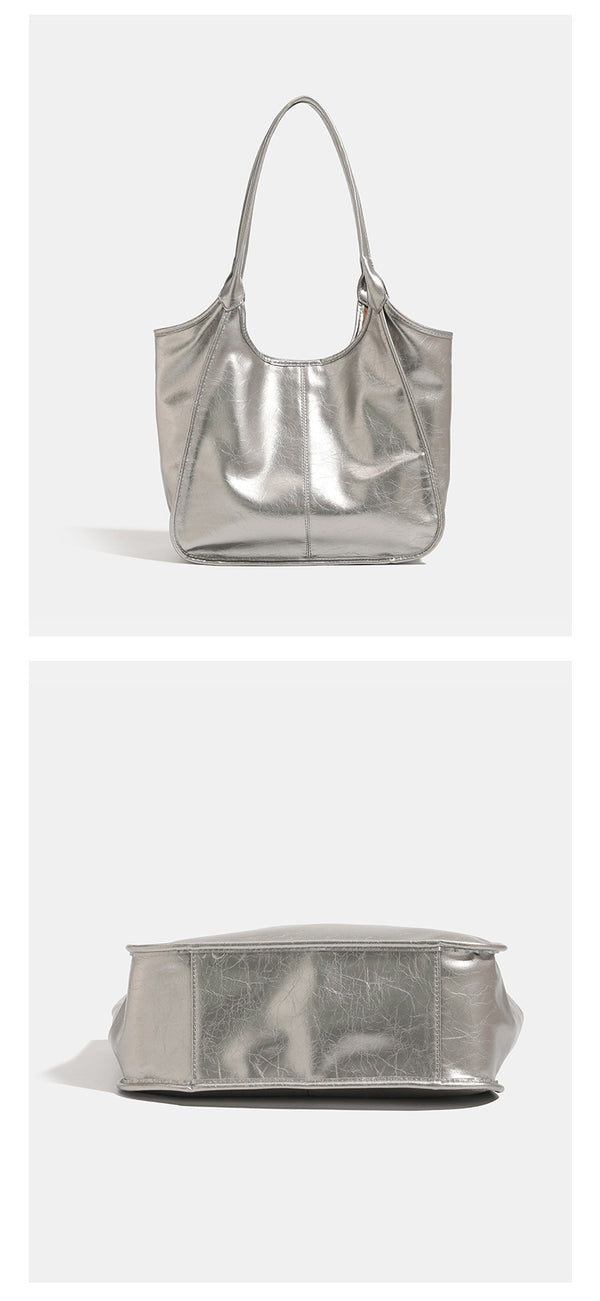 Large open-top shoulder tote bag with glossy crinkled metallic finish and long double straps, detail view 12