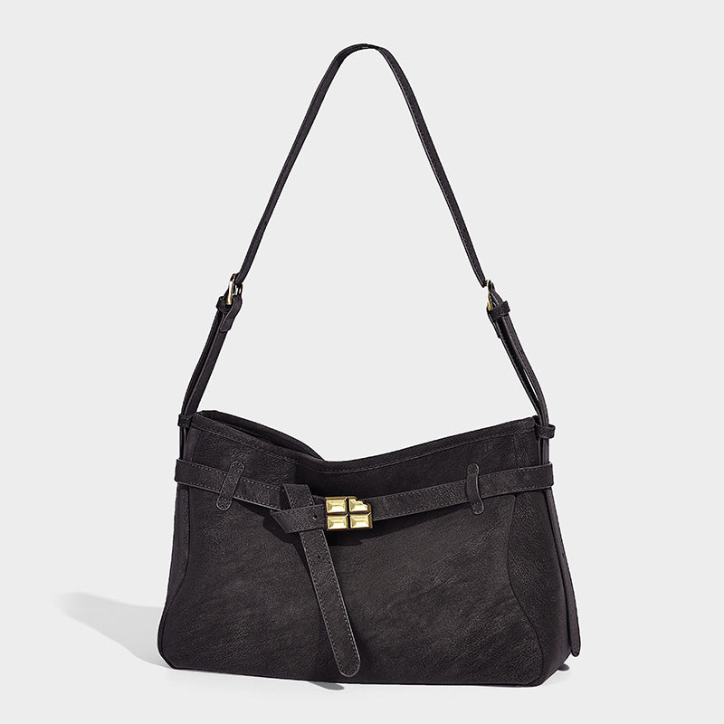 Structured matte leather-look crossbody bag with front belt strap and gold-tone square clasp hardware, front view