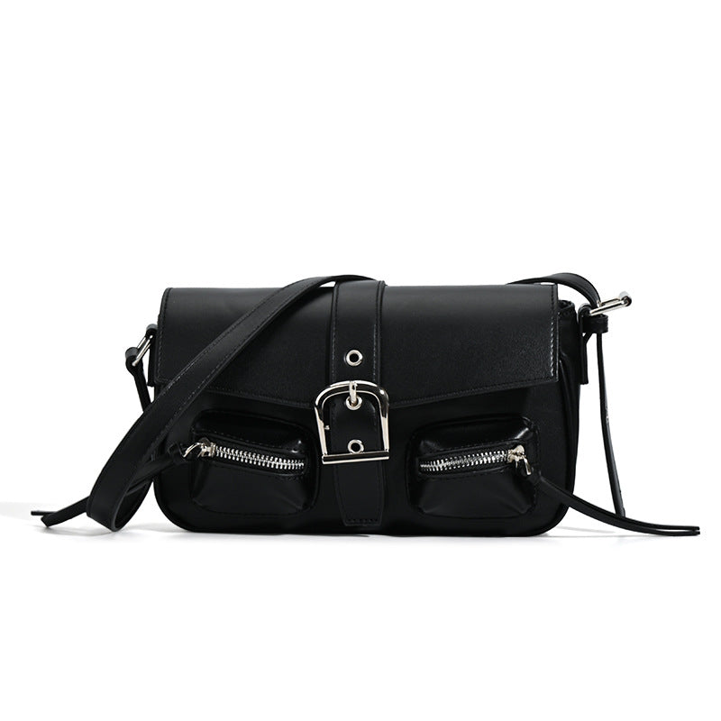 Structured flap crossbody bag with front buckle strap and dual zip pockets in smooth leather-look finish with silver-tone
