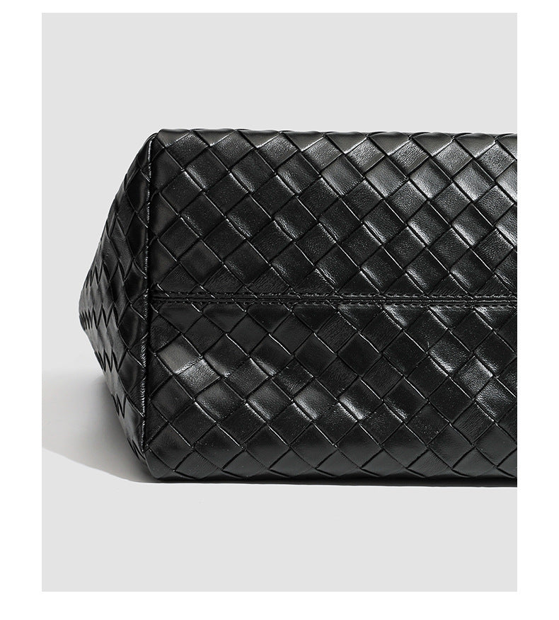 Large structured black woven diamond-pattern tote bag with braided double shoulder straps and glossy leather-look finish