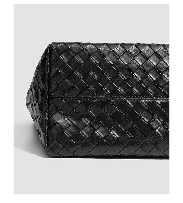 Large structured black woven diamond-pattern tote bag with braided double shoulder straps and glossy leather-look finish