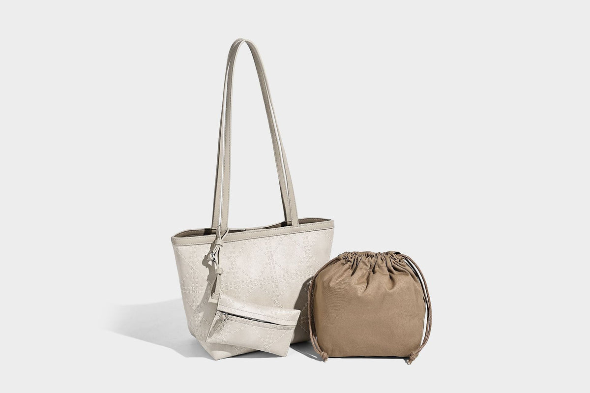 Quilted diamond-pattern tote bag with attached front zip pouch and long shoulder straps, detail view 28