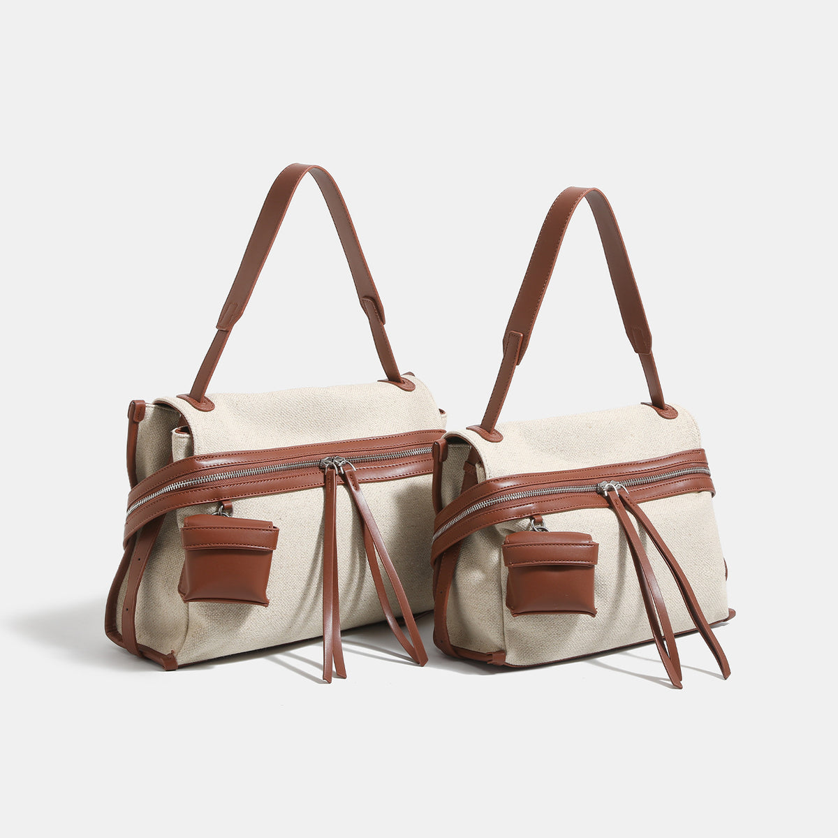 Off-white woven cotton-linen shoulder bag with brown leather-look trim, dual zip closure, long zipper pulls, front exterior