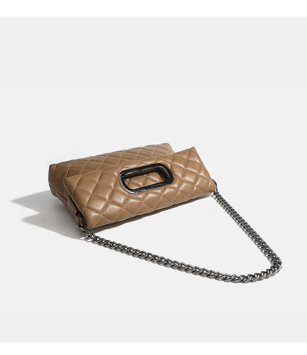 Quilted diamond-stitch flap crossbody bag with gunmetal chain strap and cut-out bar handle, detail view 16