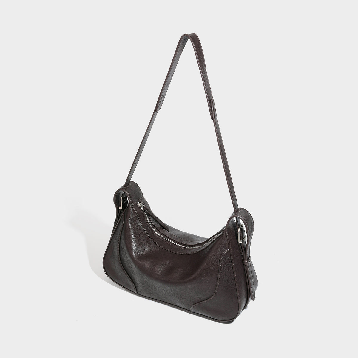 Slouchy crescent hobo shoulder bag in dark brown pebbled leather-look finish with zip top and long shoulder strap, detail