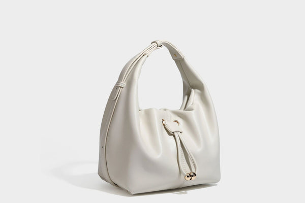 Slouchy hobo bag with smooth leather-look finish, drawstring cinch closure, and gold-tone bead hardware, detail view 22