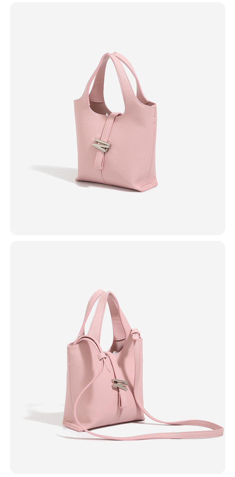 Mini pebbled leather-look bucket tote with silver toggle clasp and dual top handles, detail view 11
