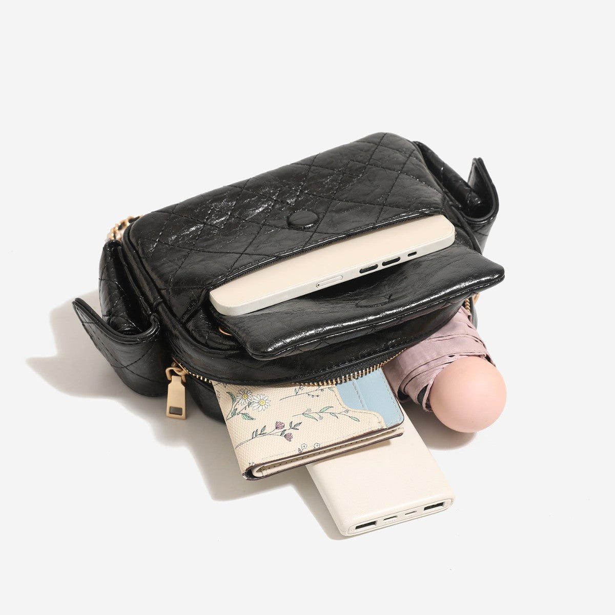 Compact quilted leather-look crossbody bag with gold-tone chain strap and double zip closure, detail view 4