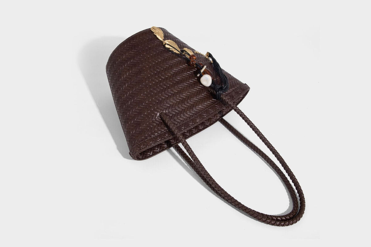 Chevron-woven bucket tote bag with braided shoulder straps and matching drawstring pouch, detail view 28