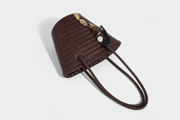 Chevron-woven bucket tote bag with braided shoulder straps and matching drawstring pouch, detail view 28