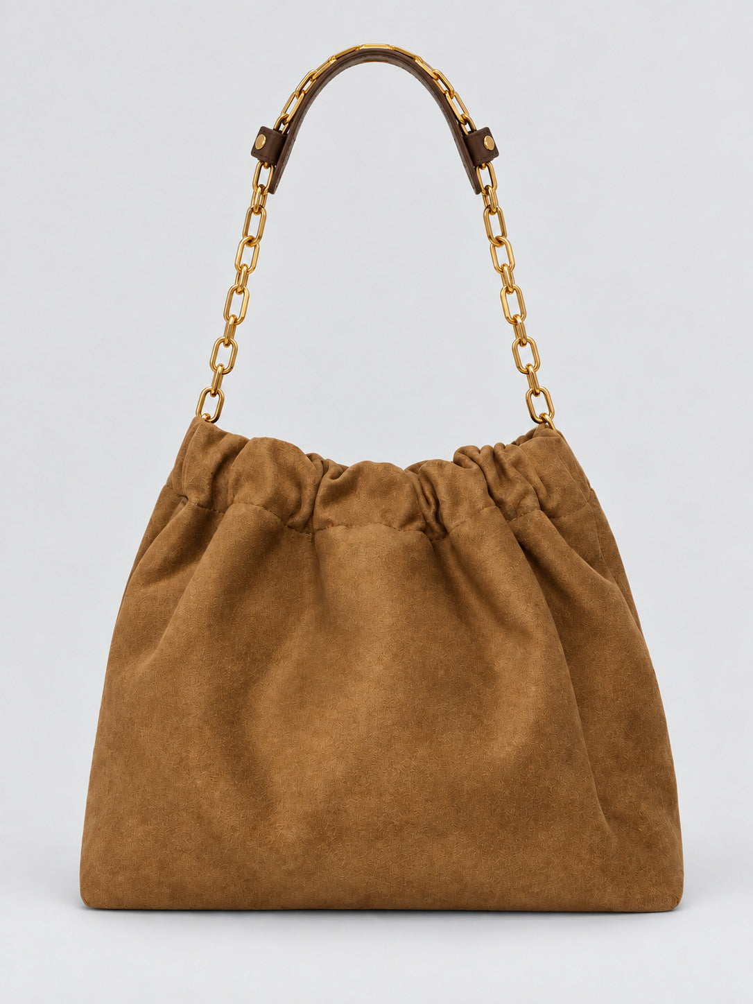 Slouchy suede-look shoulder bag with gathered top, angular stitched paneling, and chunky gold-tone chain strap, detail view
