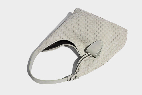 Slouchy woven hobo shoulder bag with knotted strap and matte leather-look textured finish, detail view 20