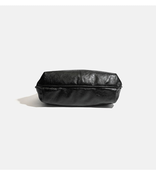 Large slouchy hobo shoulder bag with silver eyelet trim and glossy leather-look finish, detail view 10