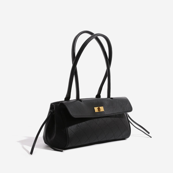 Structured black baguette bag with diamond-quilted front panel, gold-tone turn-lock flap closure, and dual looped top
