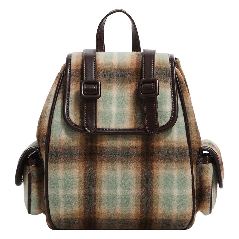 Compact vintage plaid backpack in khaki and sage check with dark leather-look trim, buckle flap closure, and adjustable