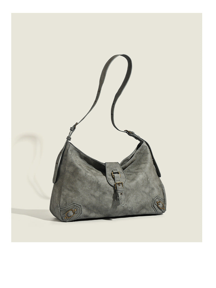 Slouchy distressed leather-look hobo bag with antique brass buckle closure and adjustable shoulder strap, detail view 12
