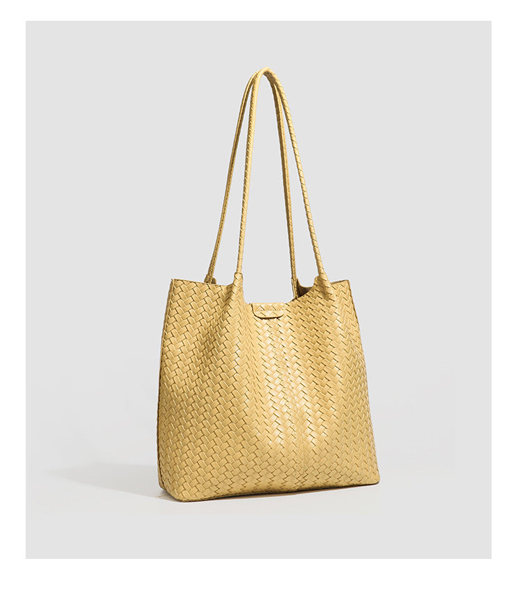 Large black basket-weave leather-look tote bag with long braided shoulder straps and matching woven zip pouch, detail view 21