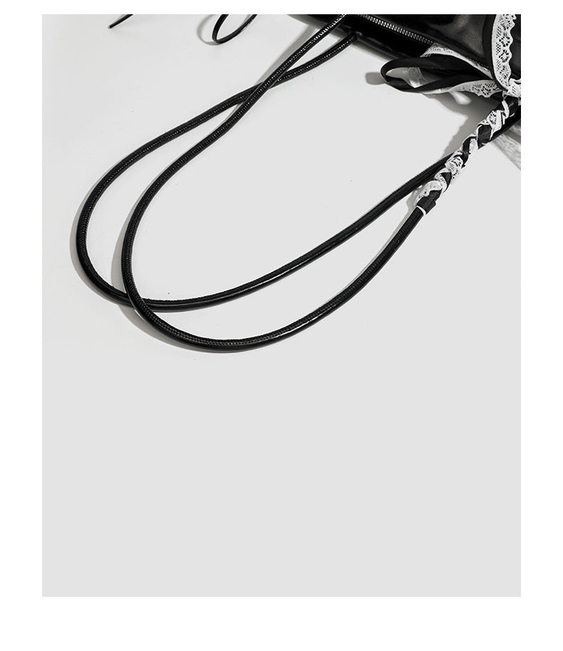 Compact glossy leather-look shoulder bag with lace bow and ribbon trim, detail view 20