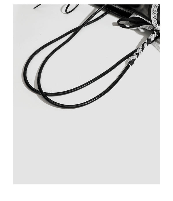 Compact glossy leather-look shoulder bag with lace bow and ribbon trim, detail view 20