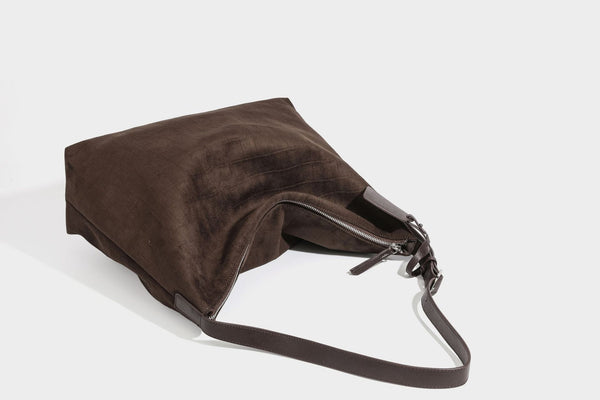 Slouchy hobo shoulder bag in matte croc-embossed leather-look finish with top zip closure and long adjustable strap, detail