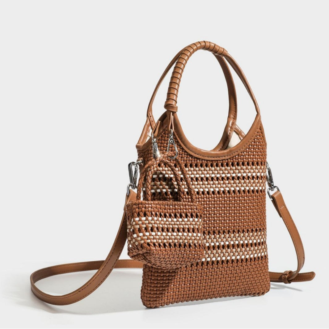 Color-block woven tote bag with rounded leather-look handles, detachable crossbody strap, and matching mini clip-on pouch in