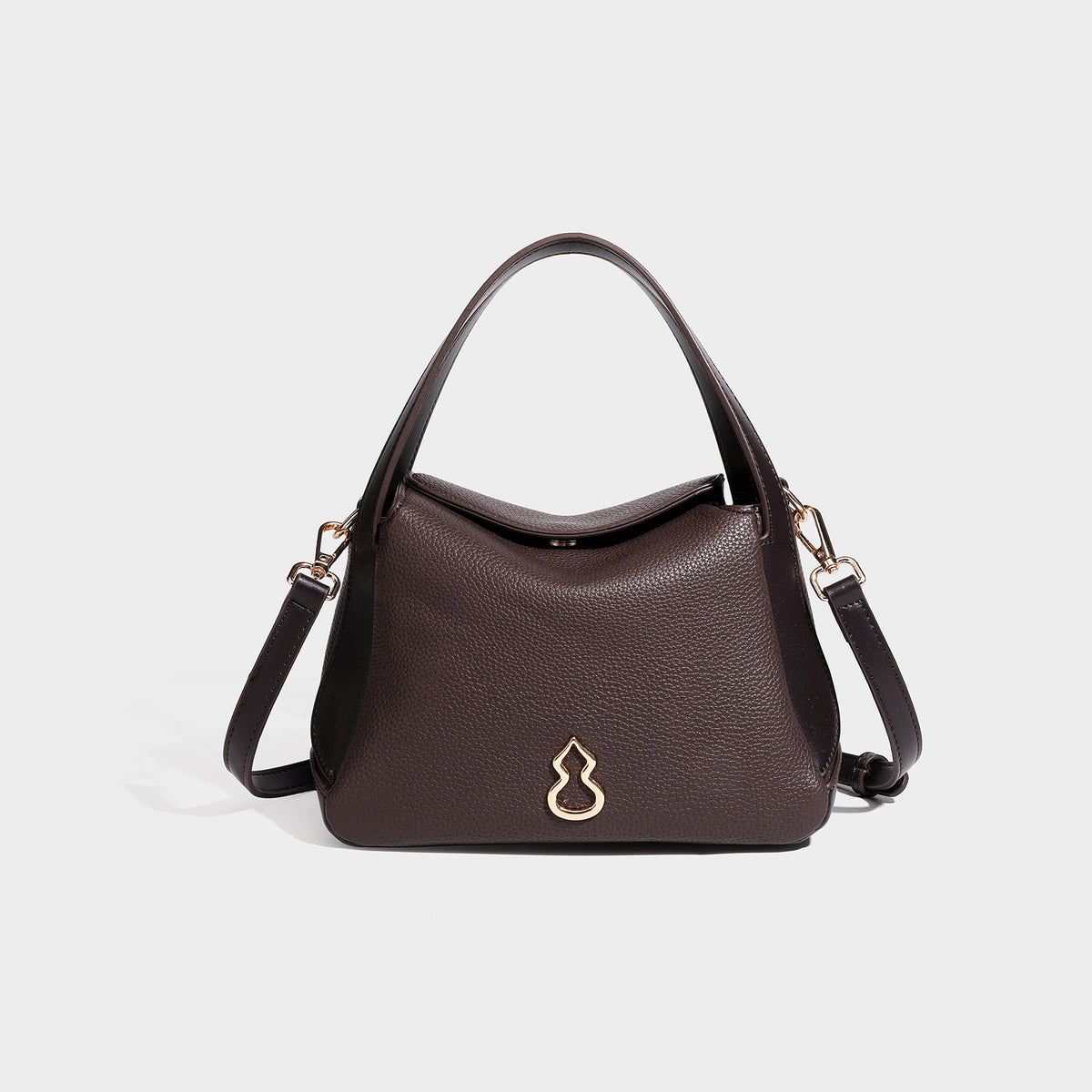 Structured pebbled leather-look shoulder bag with flap top, gold-tone emblem hardware, dual top handles, and detachable