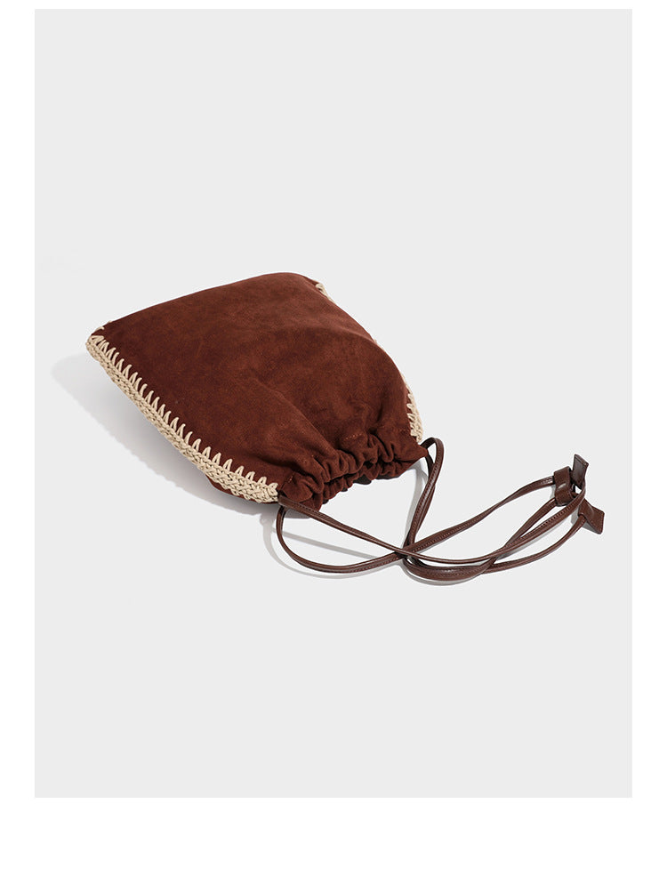 Matte suede-look drawstring bucket bag with cream braided woven edge trim and slim adjustable leather-look shoulder strap