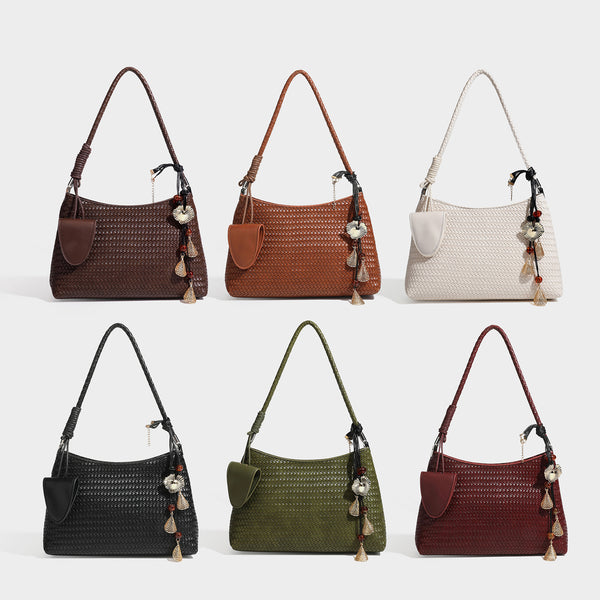 Woven-texture hobo shoulder bag in brown with braided top handle, adjustable crossbody strap, front flap pocket, and, detail