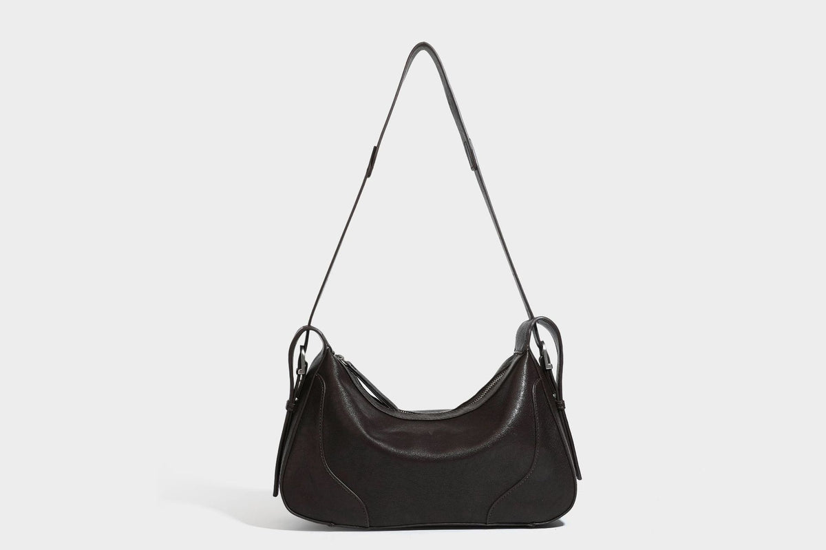 Slouchy crescent hobo shoulder bag in dark brown pebbled leather-look finish with zip top and long shoulder strap, detail