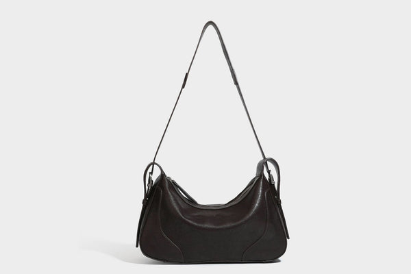 Slouchy crescent hobo shoulder bag in dark brown pebbled leather-look finish with zip top and long shoulder strap, detail