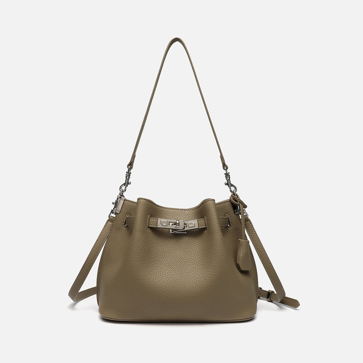 Soft-structured pebbled leather-look bucket bag with silver turn-lock front clasp and adjustable crossbody strap, detail view