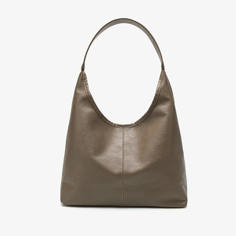 Large slouchy hobo shoulder bag in pebbled matte leather-look finish with single flat strap, detail view 7