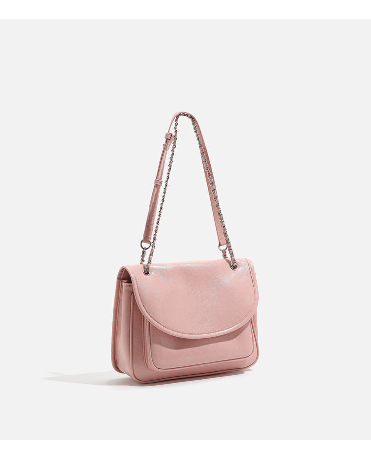 Structured glossy leather-look flap crossbody satchel with woven chain-and-leather shoulder strap, detail view 14