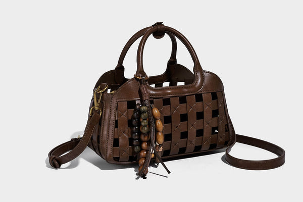 Small structured woven lattice top-handle satchel bag with bead-and-tassel charm and gold-tone hardware, detail view 17