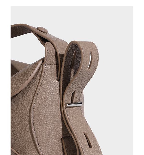 Structured curved-flap pebbled PU shoulder bag with sculptural loop strap detail, detail view 15