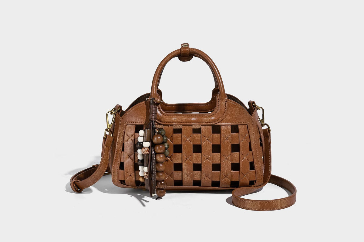 Small structured woven lattice top-handle satchel bag with bead-and-tassel charm and gold-tone hardware, detail view 34