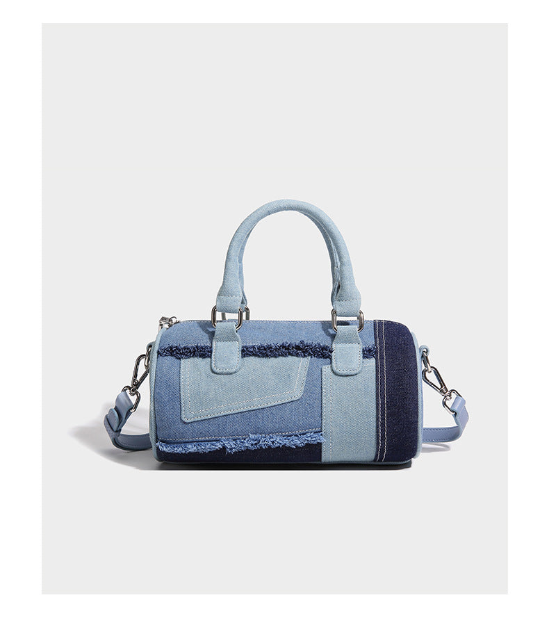 Mini barrel handbag in light and dark denim patchwork with frayed seam trim, dual top handles, top zip closure, and, detail