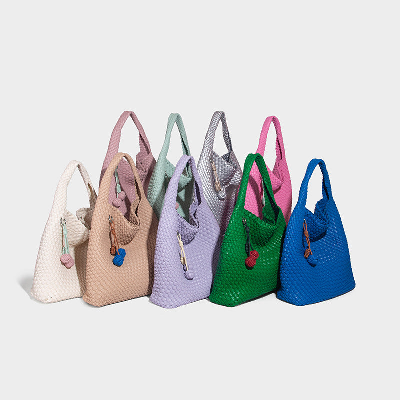 Soft hand-woven slouchy hobo tote bag with knotted tassel charm and single looped shoulder strap, detail view 2