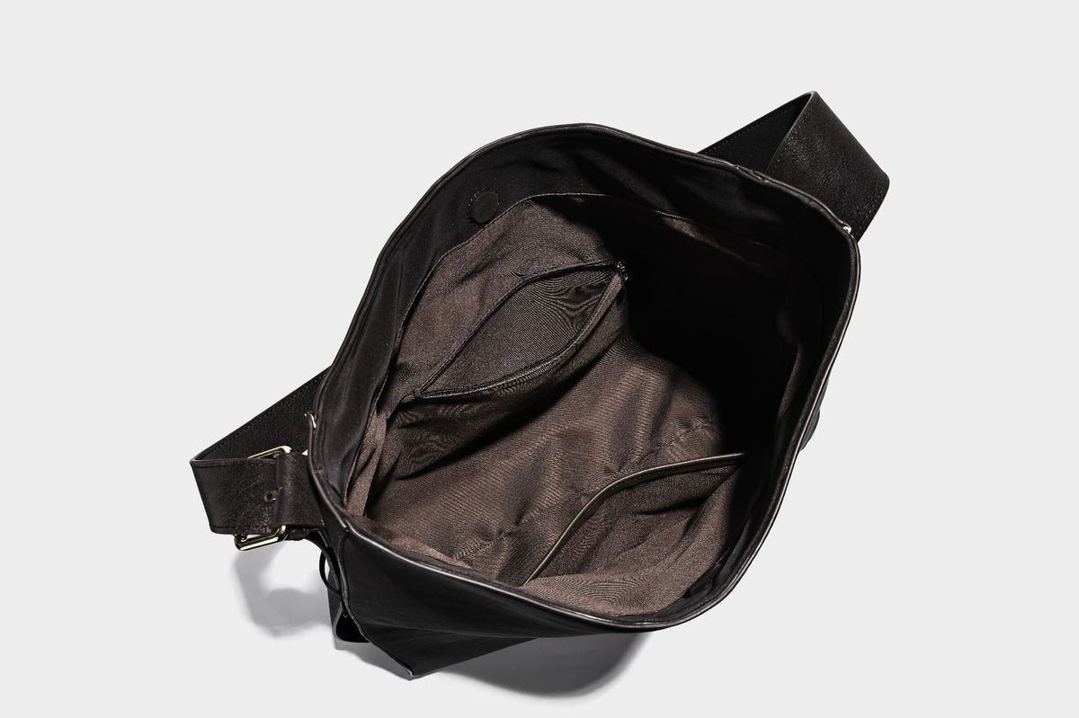 Large slouchy hobo shoulder bag in matte leather-look finish with adjustable strap and gold-tone bar hardware, detail view 30