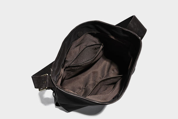 Large slouchy hobo shoulder bag in matte leather-look finish with adjustable strap and gold-tone bar hardware, detail view 30