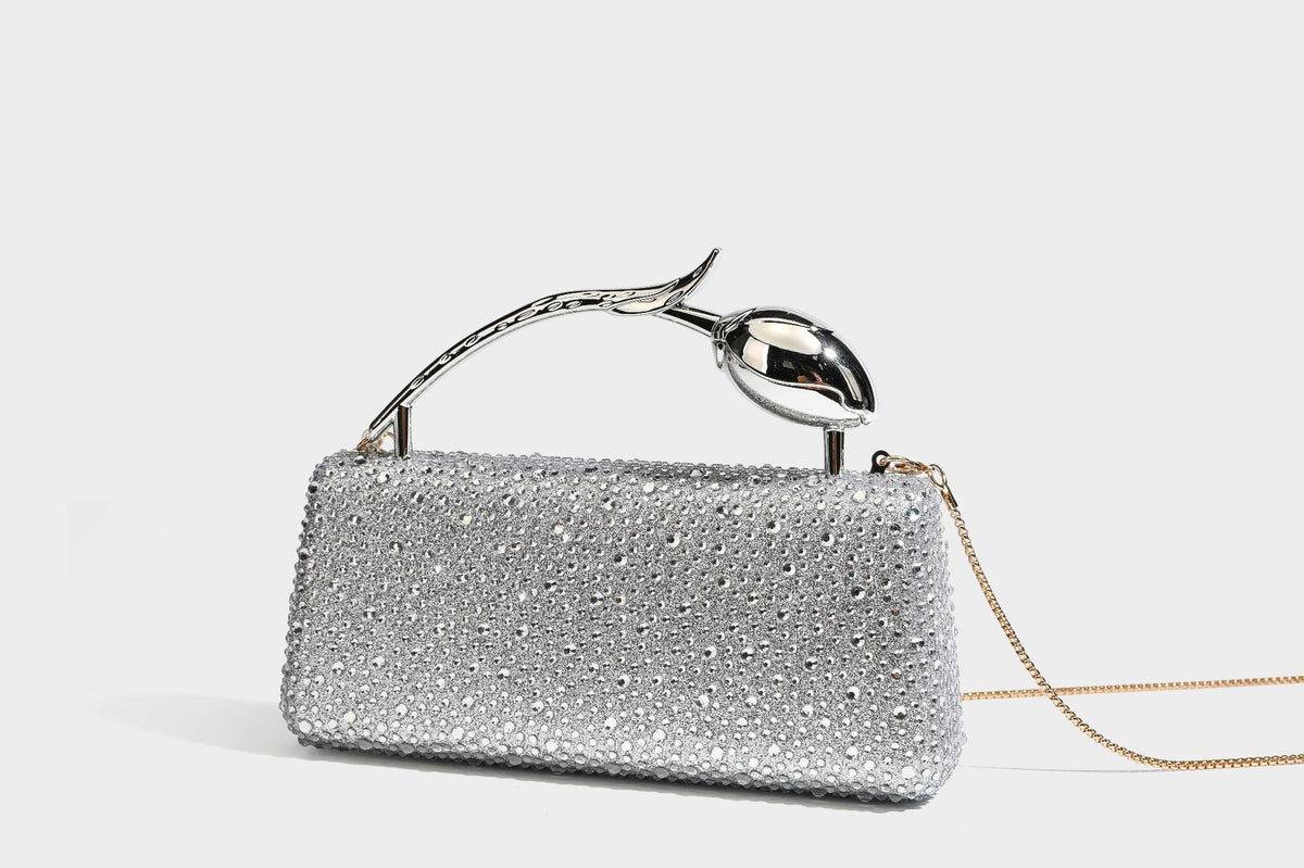rectangular hard-case rhinestone evening clutch with sculptural gold-tone branch-and-bud top handle and detachable chain
