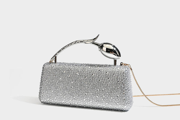 rectangular hard-case rhinestone evening clutch with sculptural gold-tone branch-and-bud top handle and detachable chain