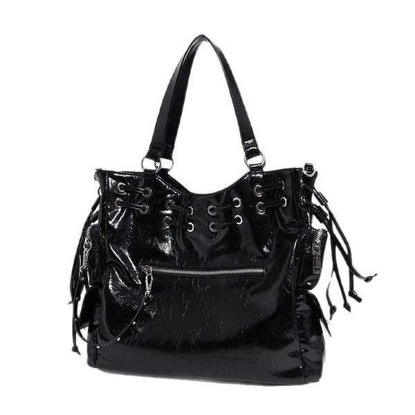 Glossy crinkled leather-look tote bag with silver grommet lace-up front detail, dual top handles, and detachable shoulder