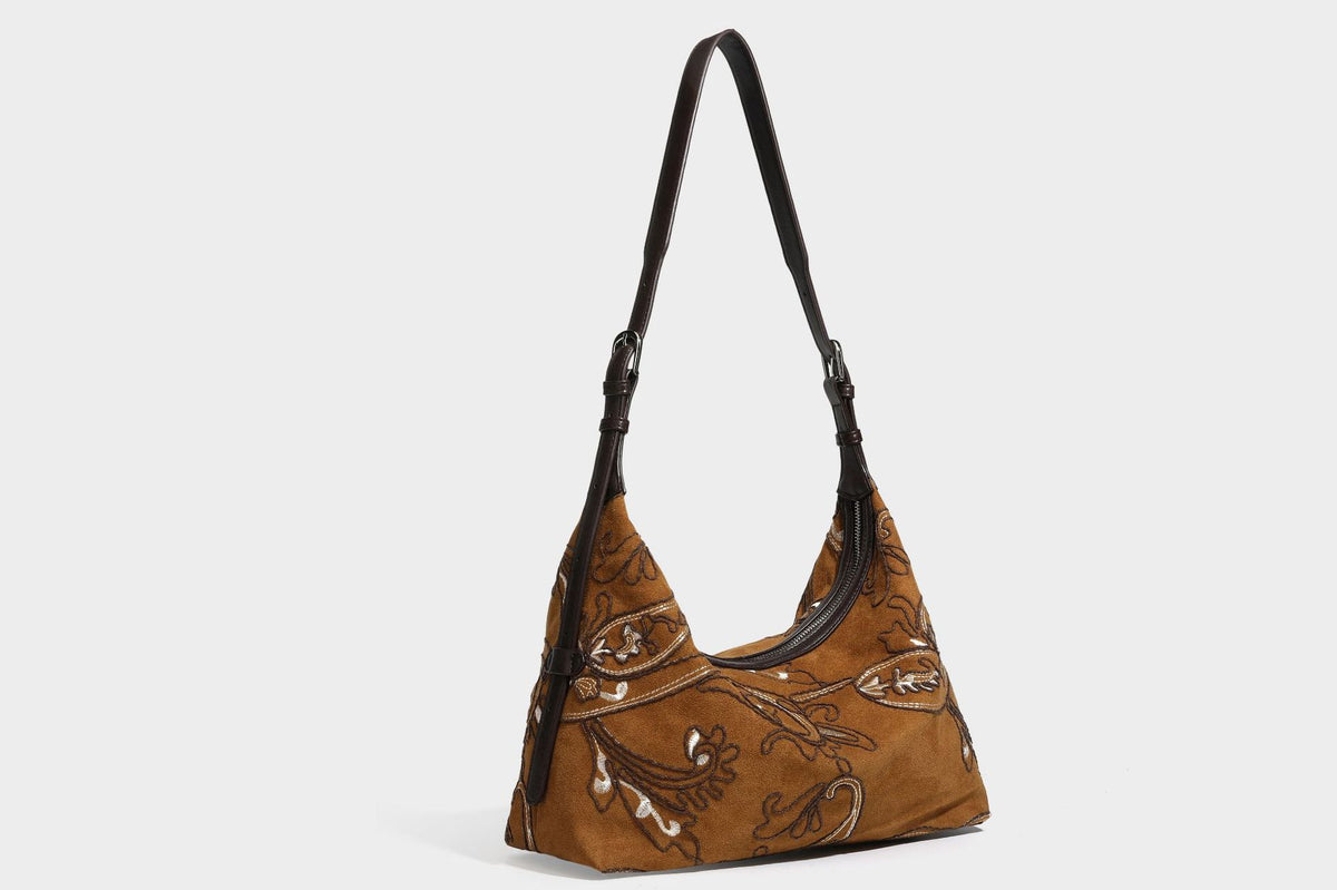 Deep chocolate suede-look hobo shoulder bag with tonal paisley floral embroidery, smooth dark leather-look trim, top zip