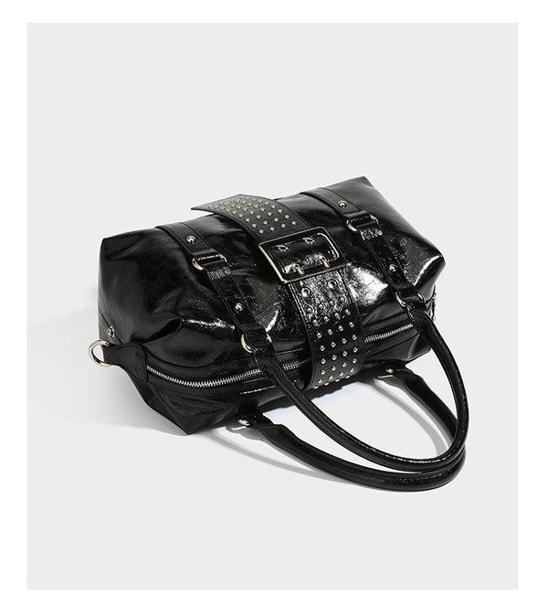 Glossy crinkled barrel handbag with silver stud buckle strap and detachable shoulder strap, detail view 11